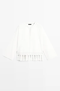 Embroidered blouse with fringed hem