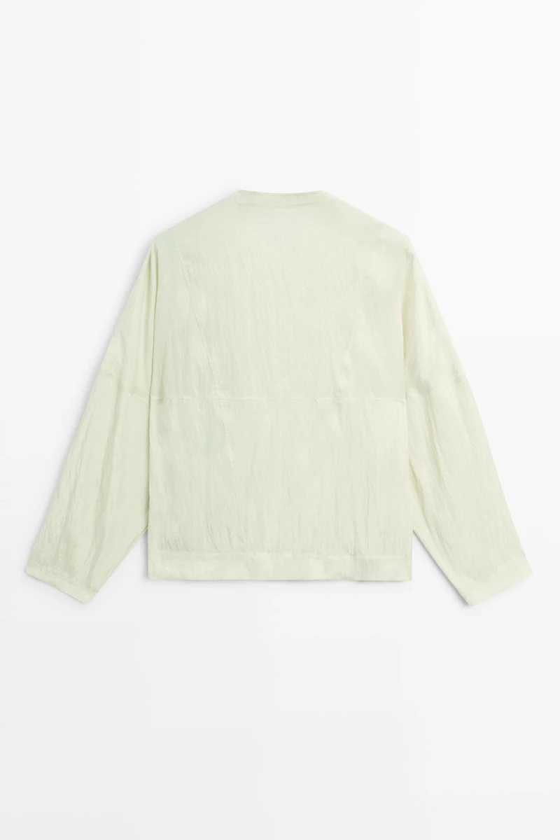 Fluid wrap shirt with button detail
