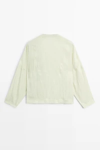 Fluid wrap shirt with button detail