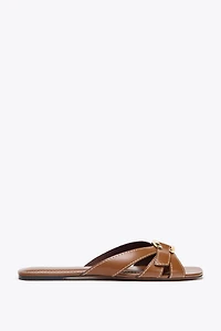CROSSED SANDALS WITH METALLIC DETAIL