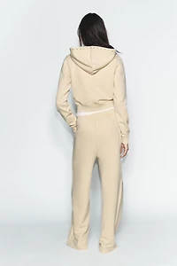PANTALON EN MOLLETON EFFET DÉLAVÉ CLOUS
