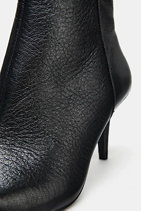 BOTTINES À TALONS EN CUIR