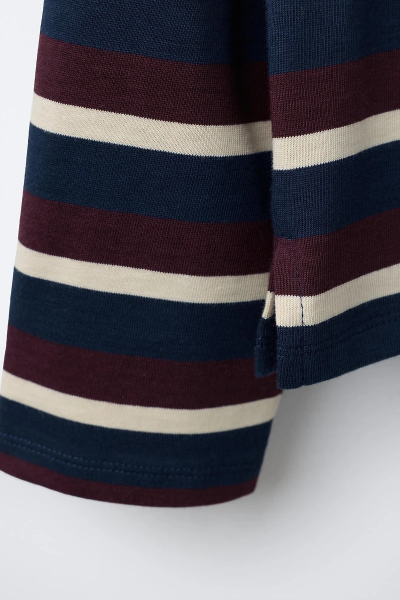 STRIPED STRANGER THINGS © NETFLIX POLO SHIRT