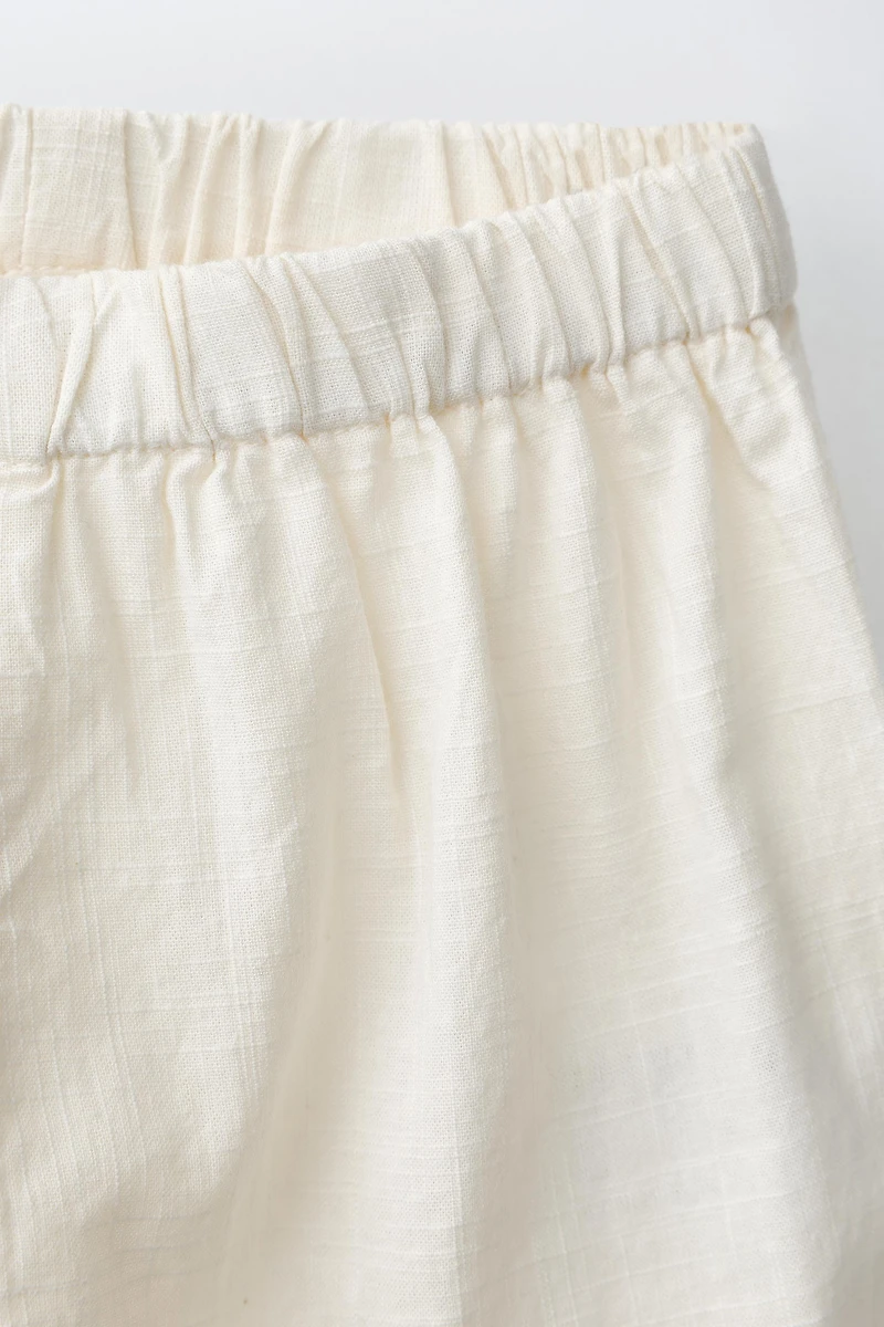 EMBROIDERED POCKET PANTS