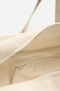CONTRAST TRAVEL BAG