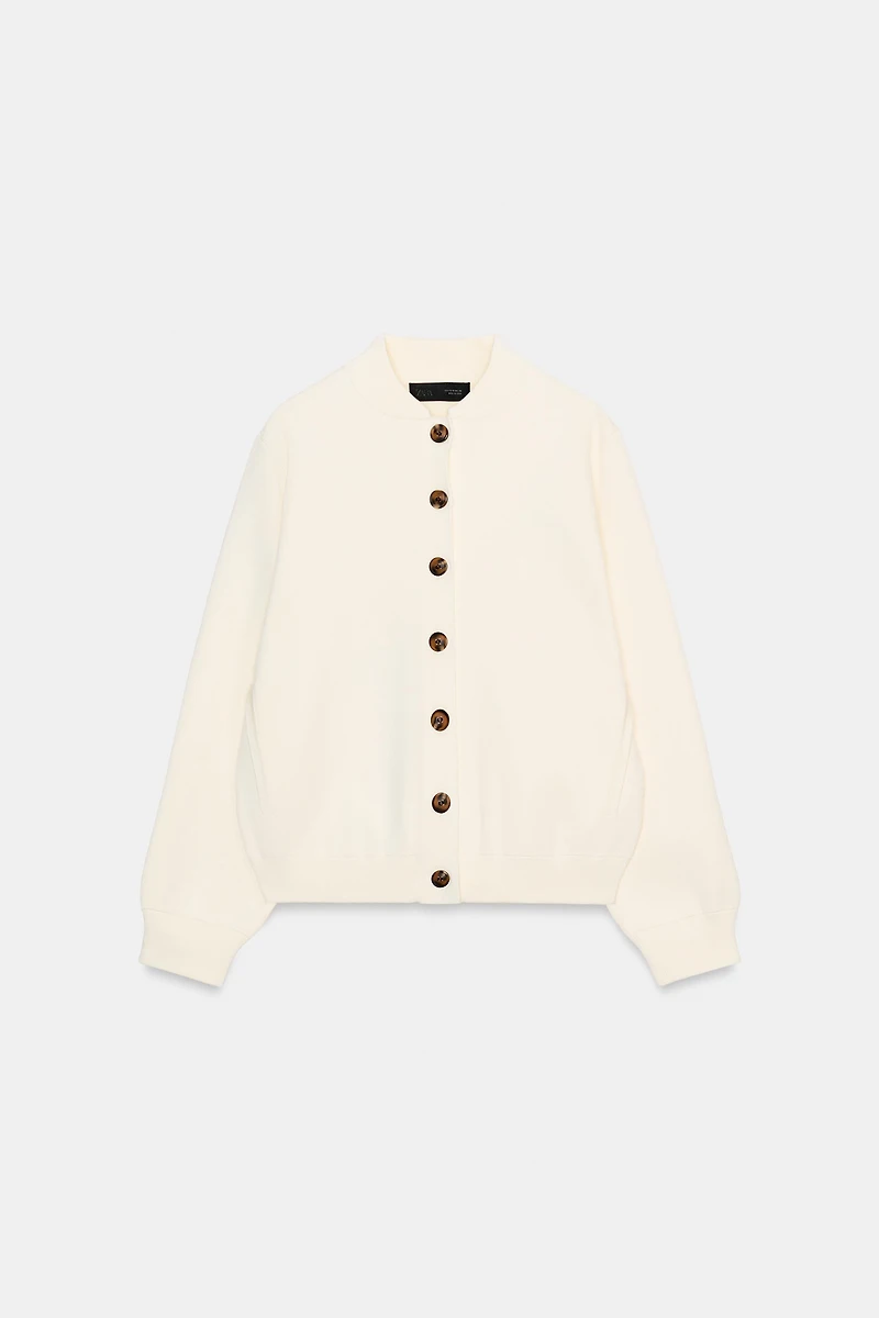 GILET EN MAILLE À BOUTON CONTRASTE