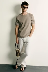 VERTICAL WOVEN CROSSBODY BAG
