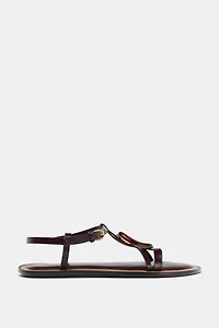 SANDALS WITH METALLIC APPLIQUÉ