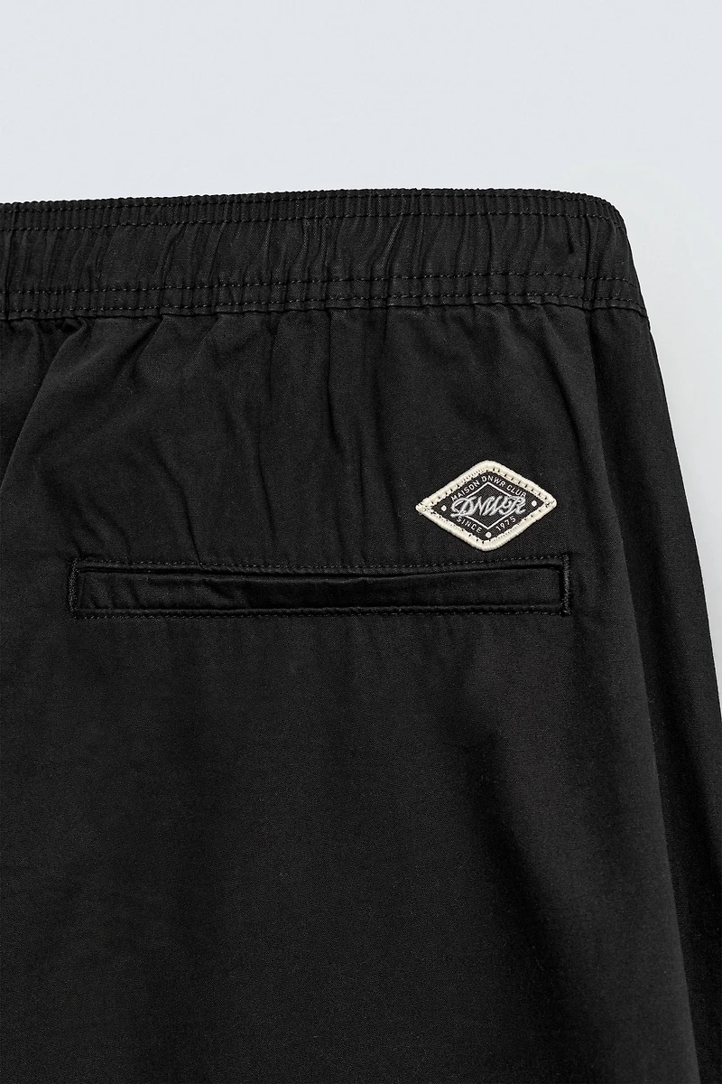 BALLOON FIT PLEATED PANTS