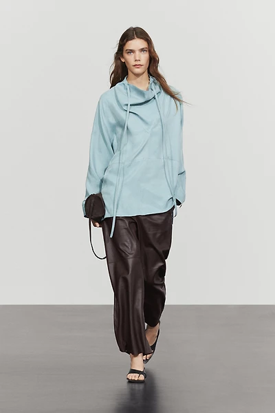 Flowing shirt with high collar and drawstring detail
