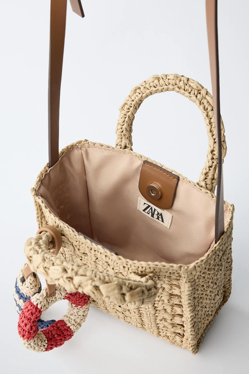 RAFFIA CROSSBODY BAG WITH MARINE CHARMS
