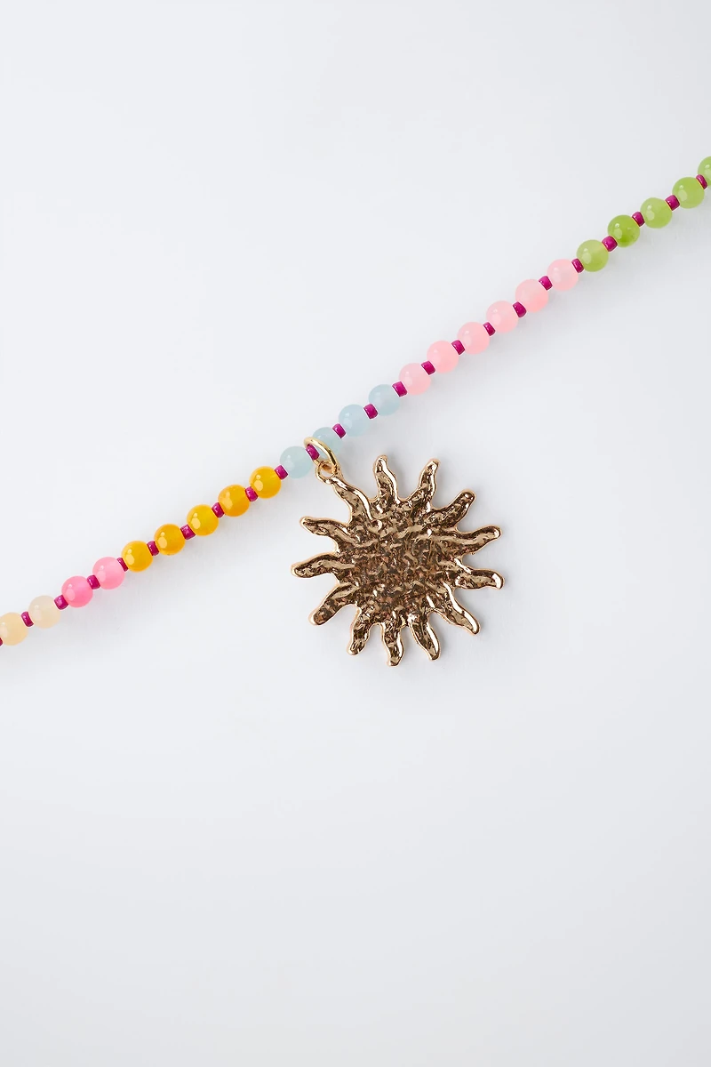 PACK OF TWO BEADED SUN NECKLACES