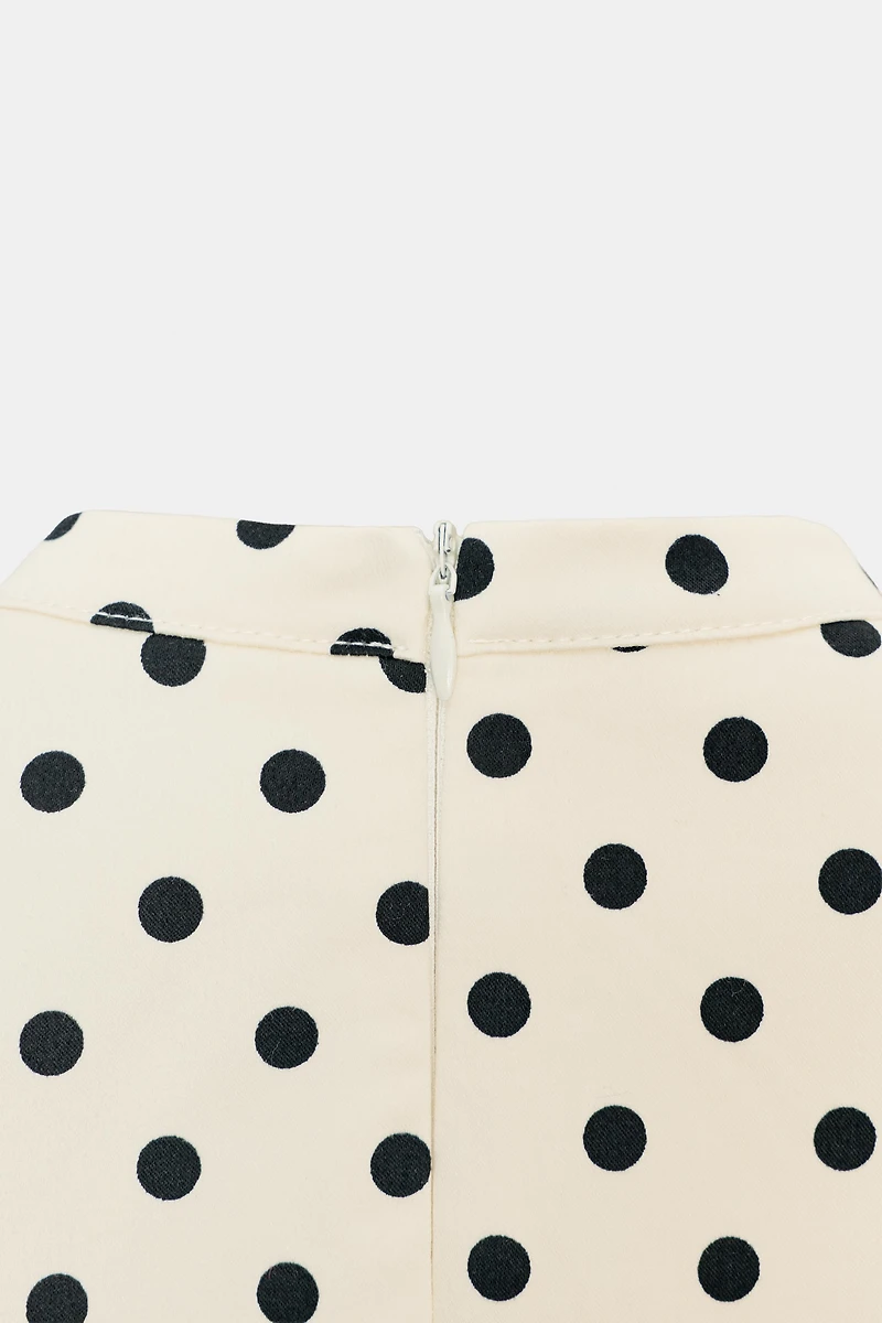 ROBE COURTE À NŒUD POIS