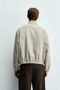 BLOUSON COURT AJUSTÉ À CARREAUX TEXTURÉ
