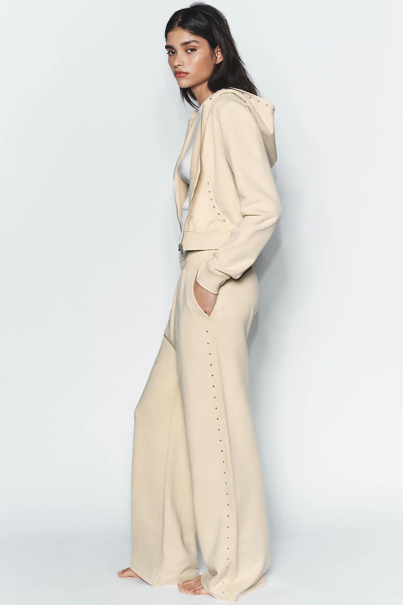 WASHED EFFECT FLEECE PANTS WITH STUDS
