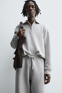 POLO EN MAILLE À COL ZIPPÉ