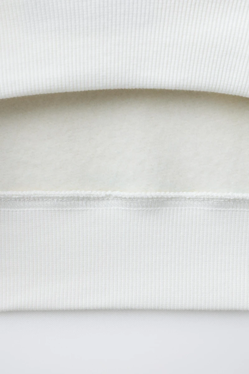 FLOCKED TEXT SWEATSHIRT