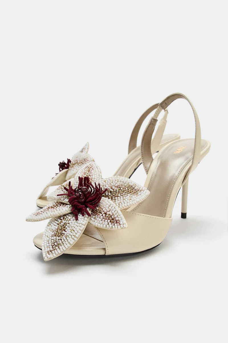 HEELED SANDALS WITH FLORAL DETAIL