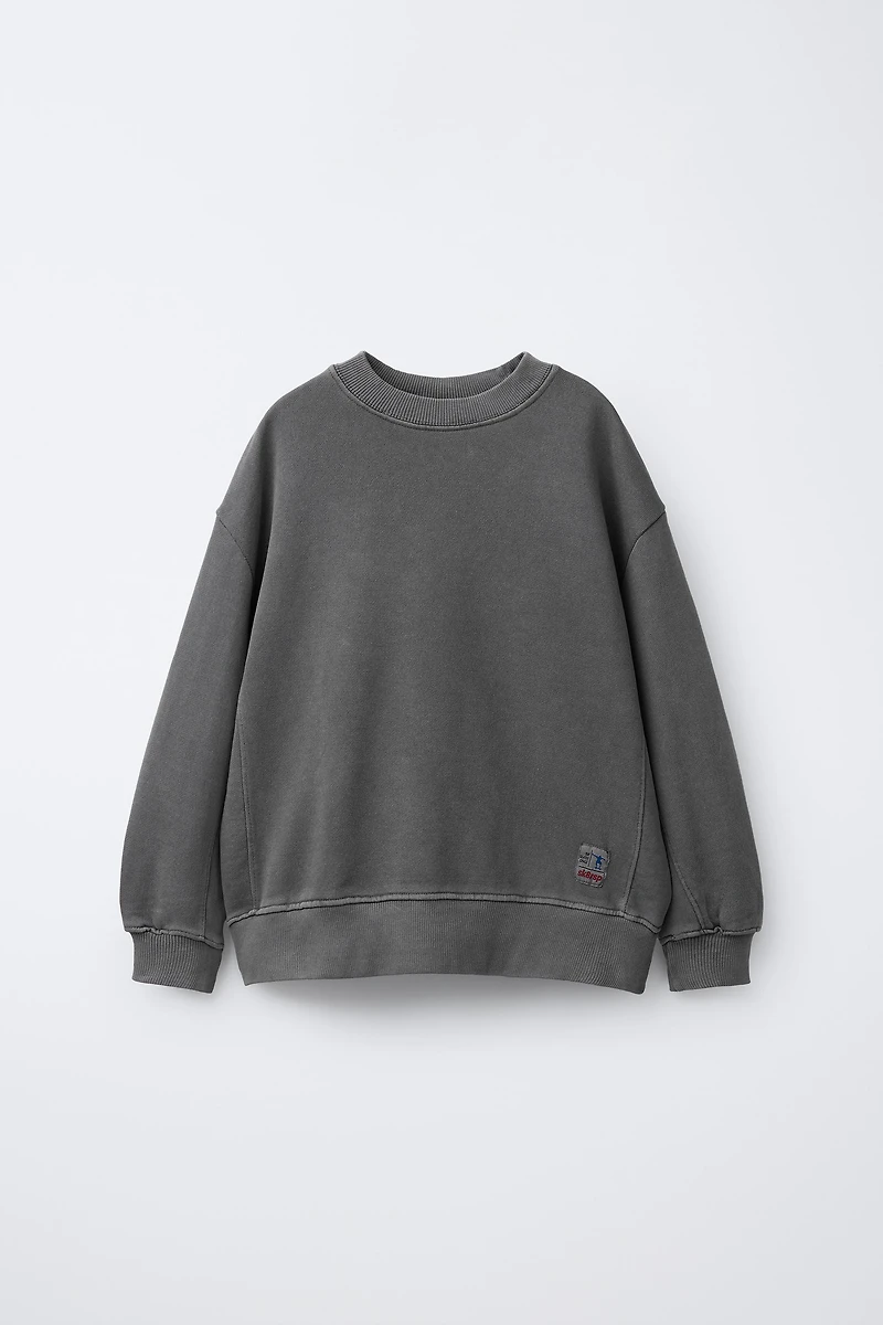 SWEAT TEINT EN PIÈCE ÉTIQUETTE