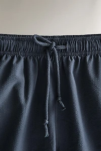 SEERSUCKER MID-LENGTH SWIM SHORTS