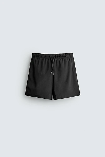 TEXTURED MID-LENGTH SWIMSUIT