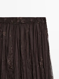 Long pleated skirt with embroidered detail