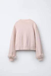 PULL EN MAILLE À PLUMES