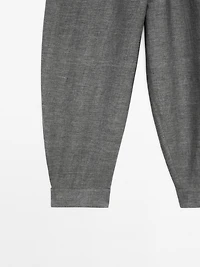 Balloon fit trousers with button details