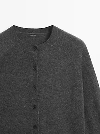 Short knit cardigan with raglan sleeves