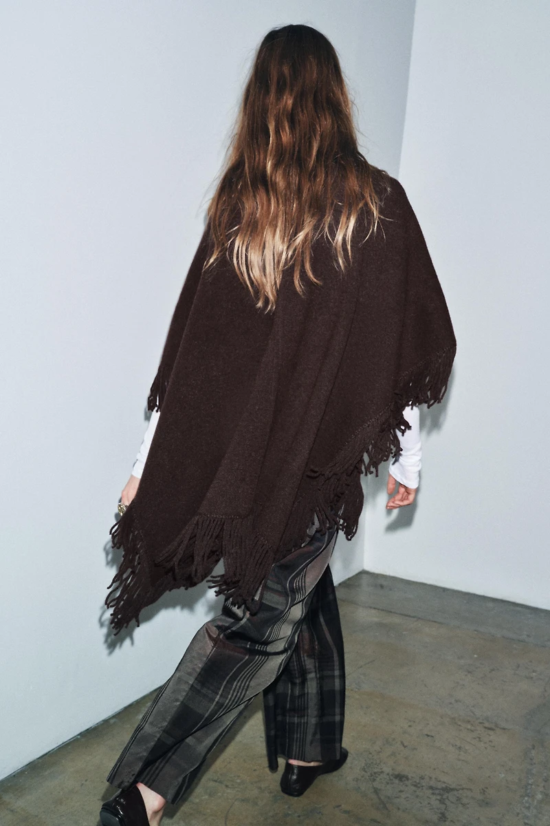 FRINGED KNIT CAPE