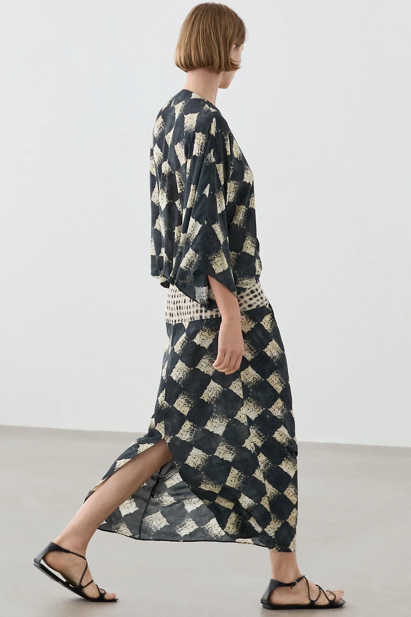 Flowing dress with sash belt detail