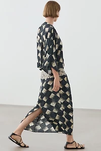 Flowing dress with sash belt detail