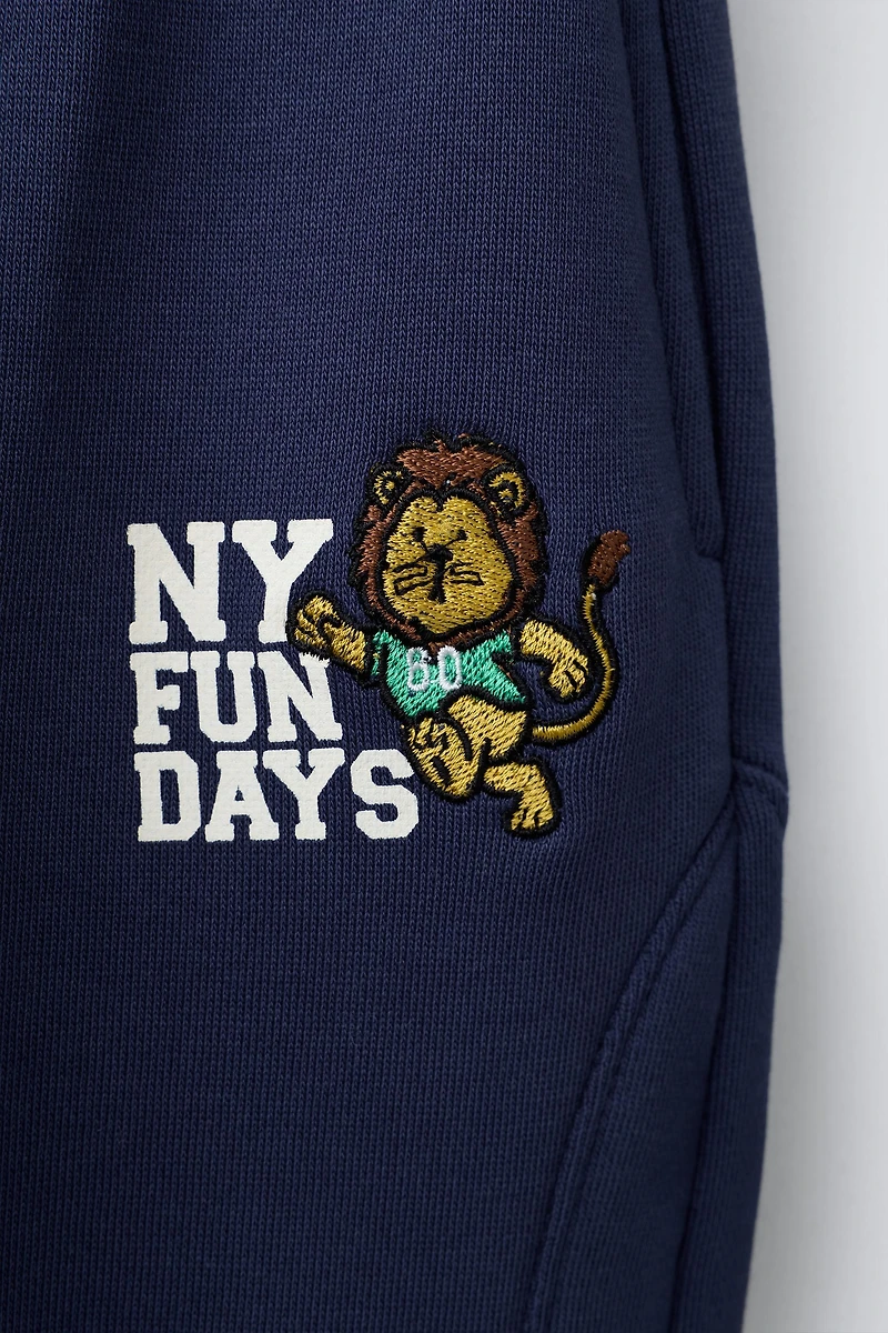 EMBROIDERED LION JOGGERS