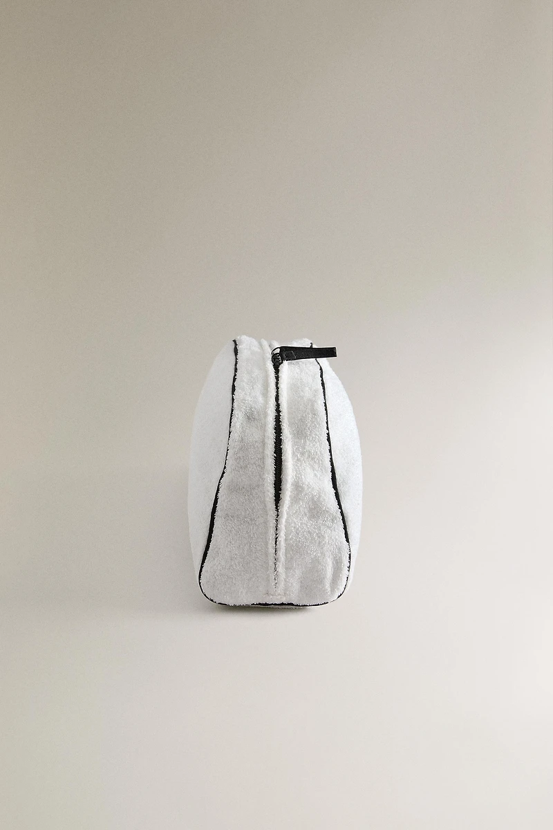 TERRY CLOTH TOILETRY BAG WITH PIPING DETAIL