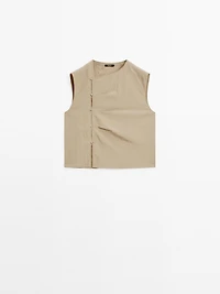 Blouse with silver button fastening on the side