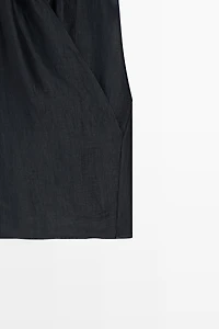 Linen blend sleeveless crossover top