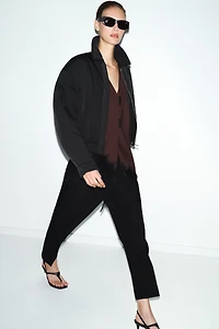 PLEATED PANTS WITH CUFFED HEM