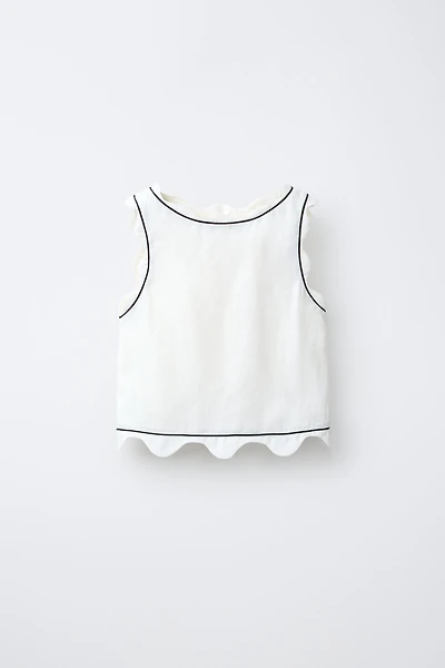 SCALLOPED TOP WITH CONTRAST PIPING