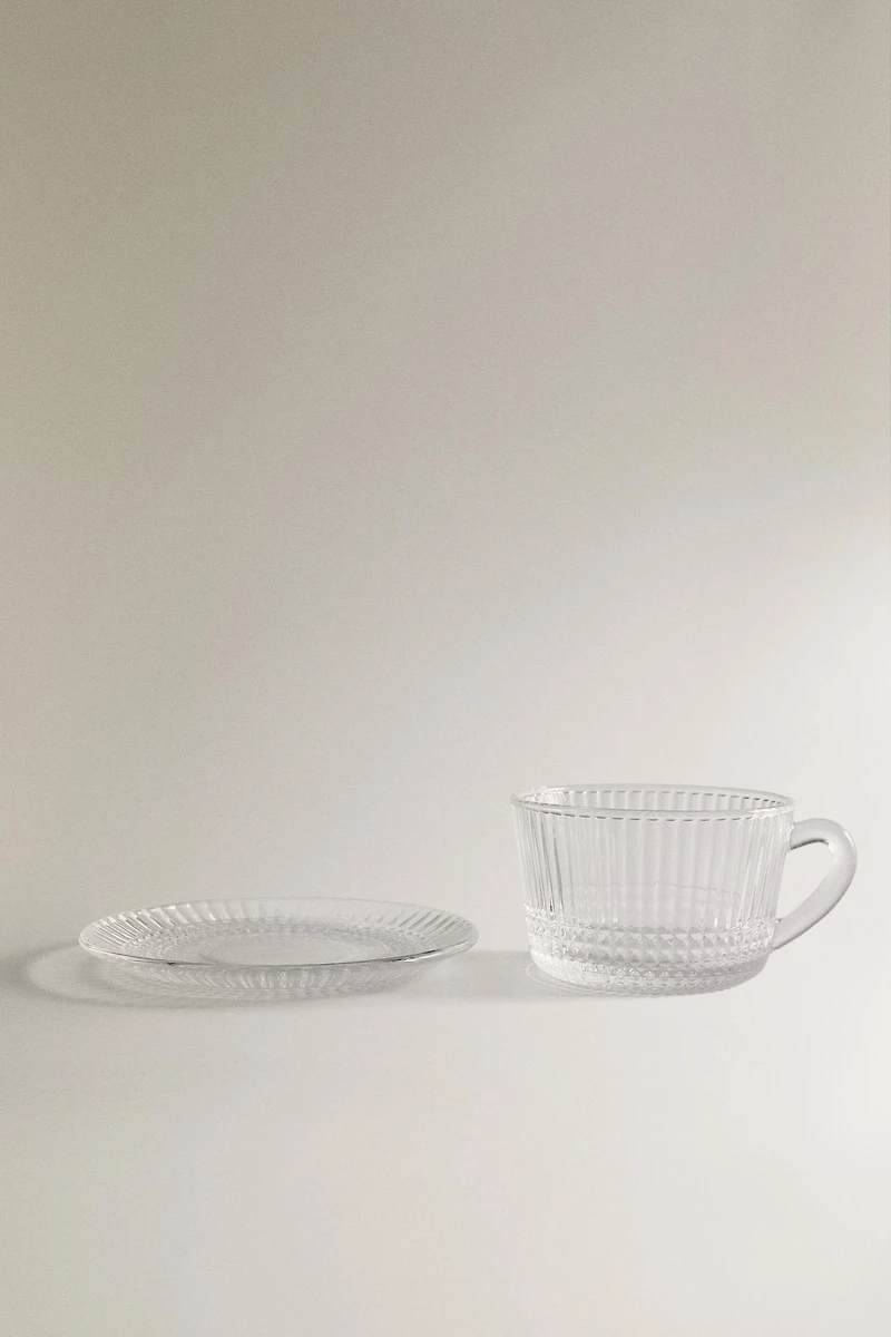 GLASS TEACUP WITH RAISED GEOMETRIC DESIGN