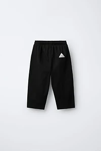 TEXTURED PANTS WITH LABEL