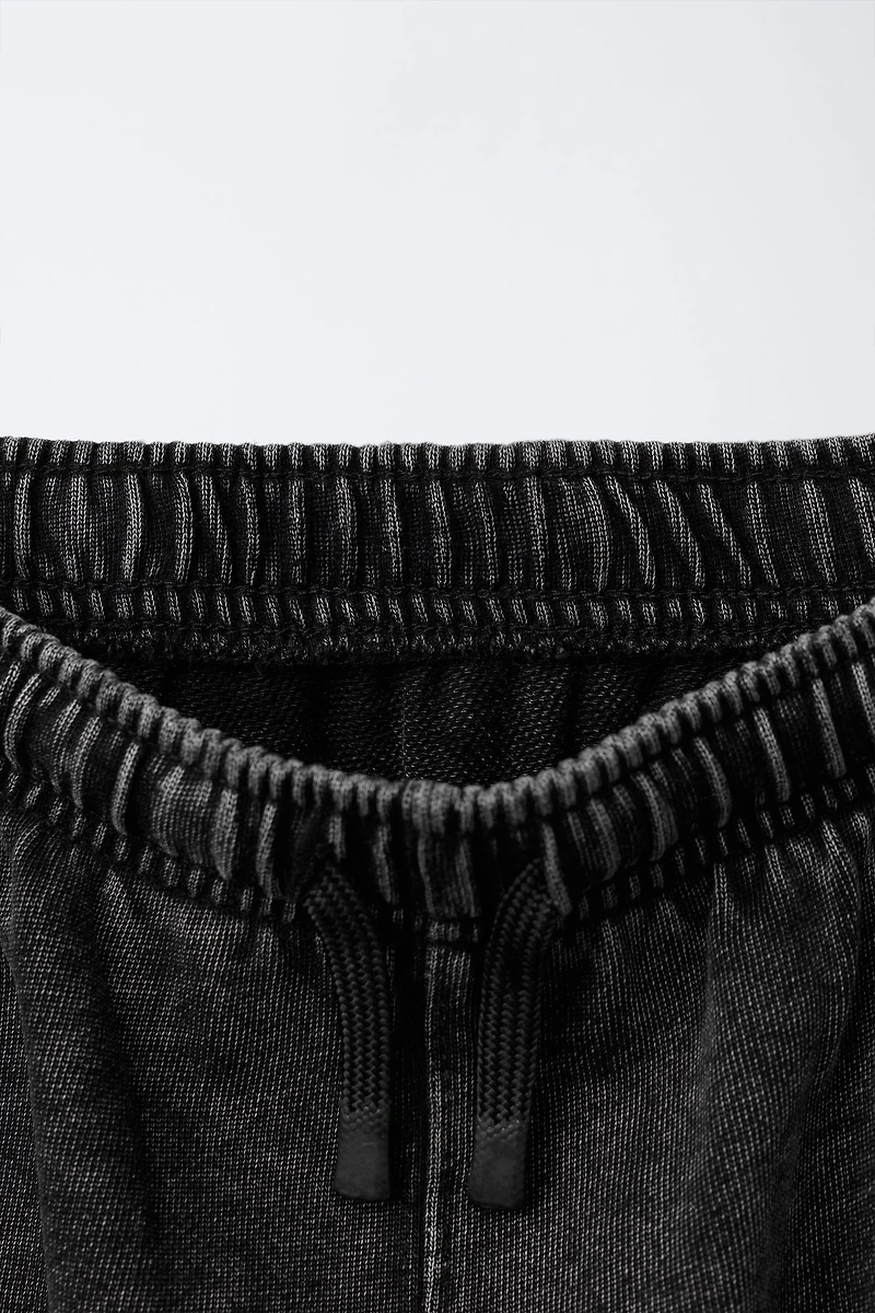 SLIM FIT PANTS WITH ZIPPERS