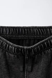 SLIM FIT PANTS WITH ZIPPERS