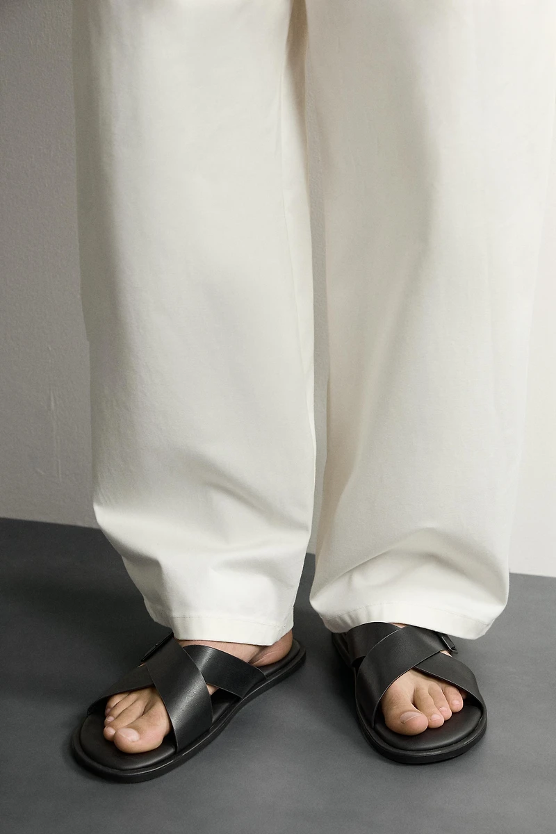 BUCKLED CRISSCROSS SANDALS