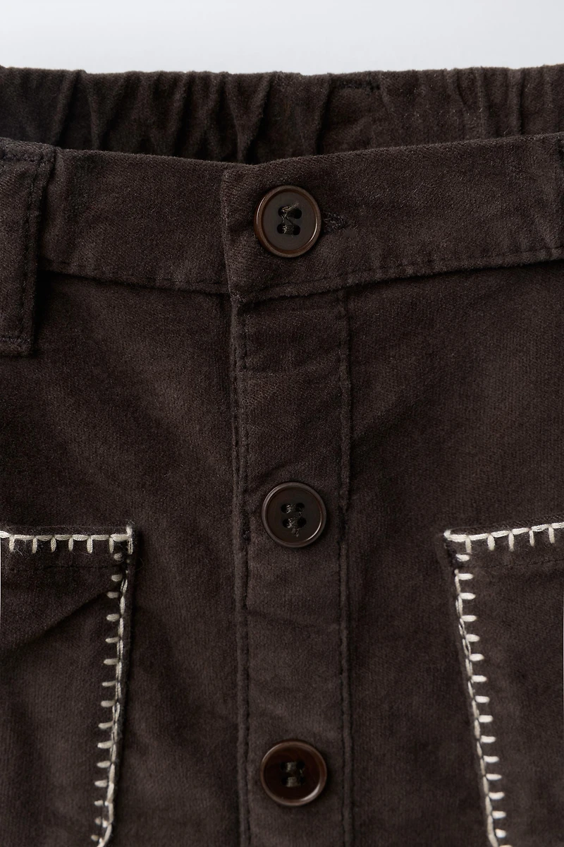 VELVET SKIRT WITH PIPING POCKETS
