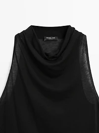 Sleeveless top with draped neckline