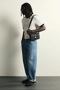 RUBBERIZED CROSSBODY BAG WITH BUCKLE