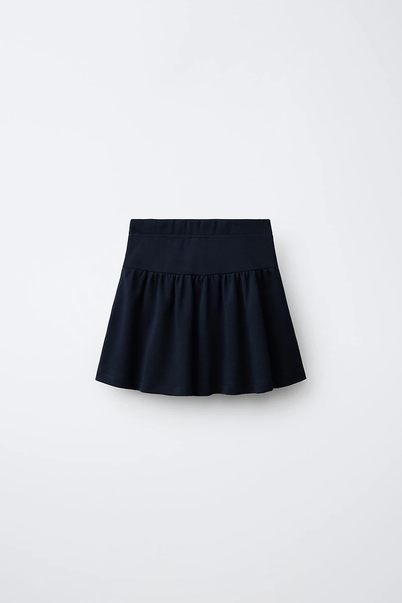 FROG FASTENING AND BUTTON SKIRT