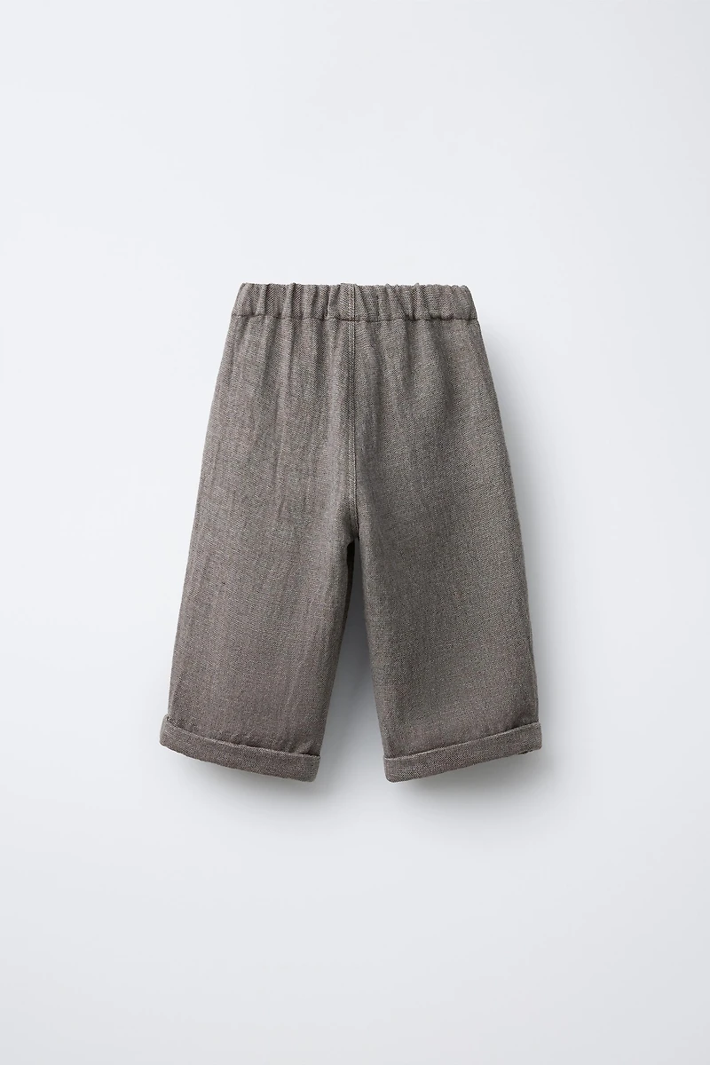 RUSTIC BAGGY PANTS WITH BUTTONS AND WOOL