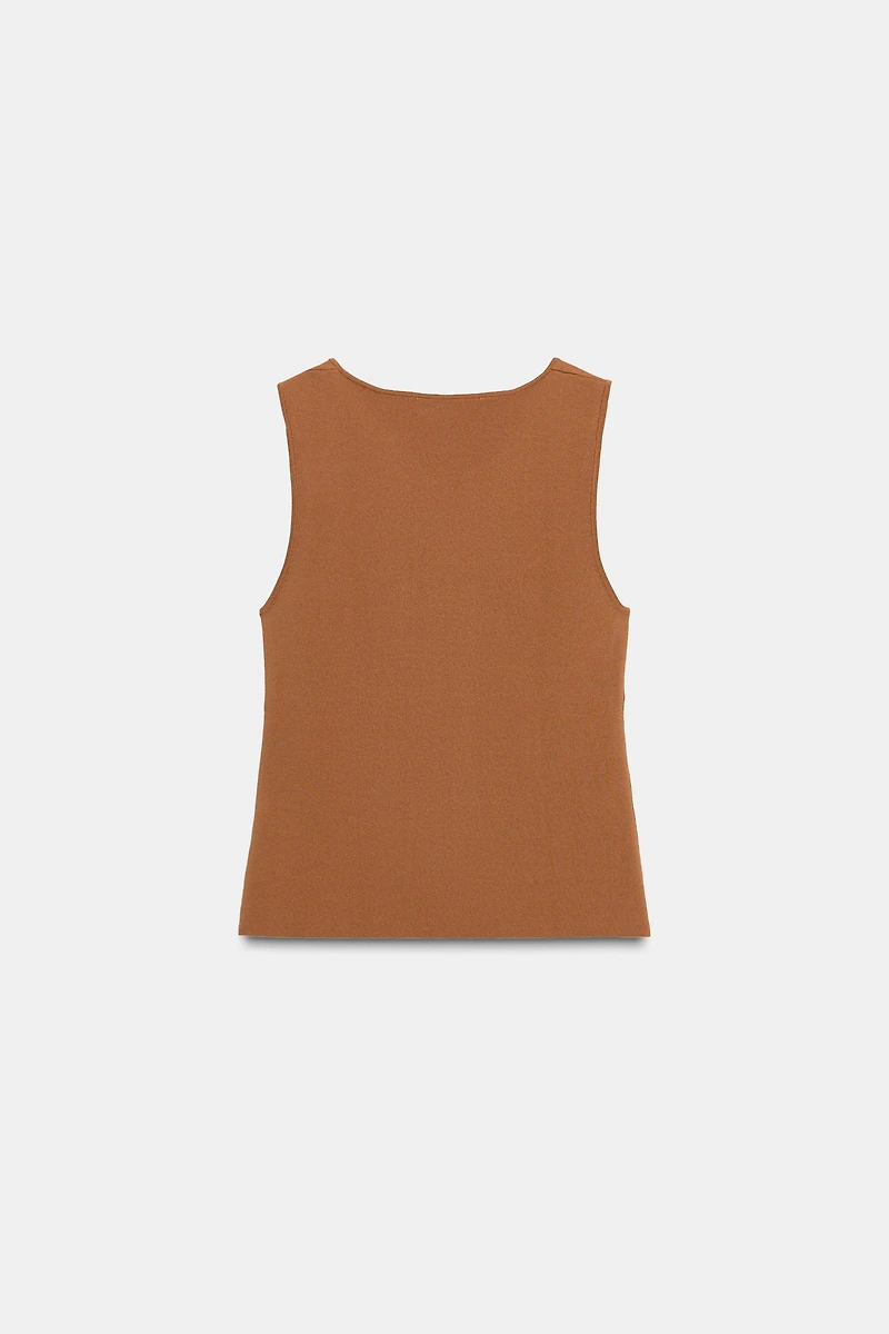 CUT OUT KNIT TOP WITH METAL DETAIL