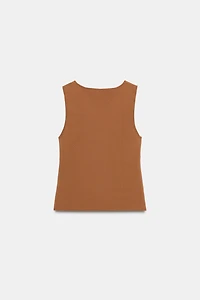 CUT OUT KNIT TOP WITH METAL DETAIL